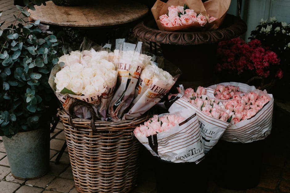 A delightful assortment of flowers in baskets and bags creates an inviting store display.